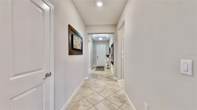 hallway featuring light tile patterned flooring