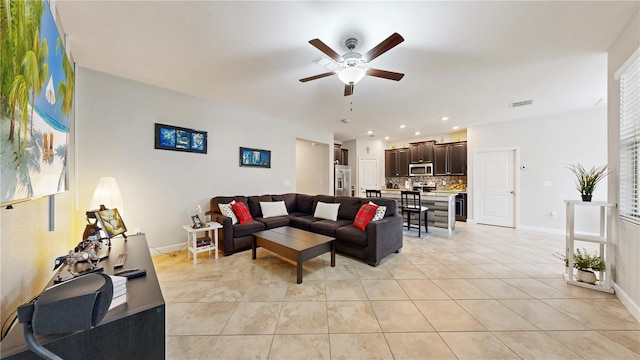 living room with ceiling fan and light tile patterned floors