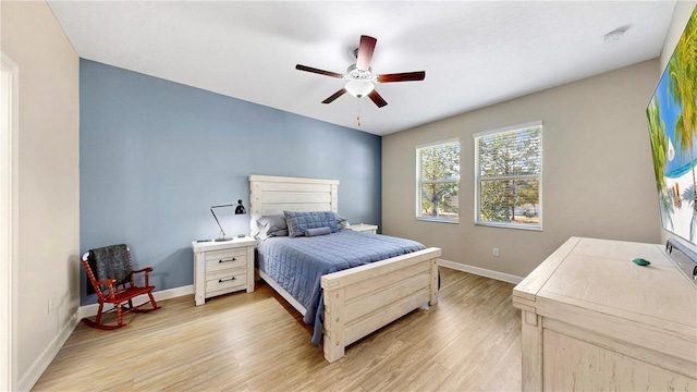 bedroom with ceiling fan and light hardwood / wood-style floors