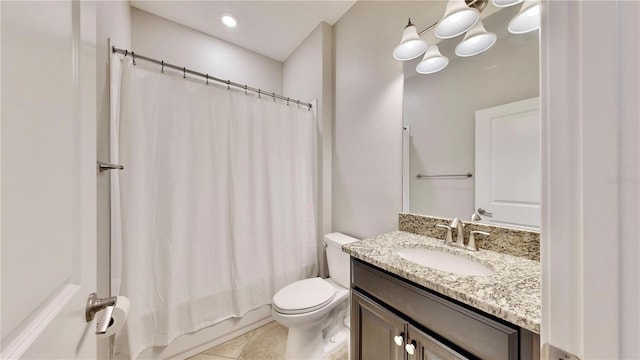 full bathroom featuring toilet, vanity, tile patterned floors, and shower / bathtub combination with curtain