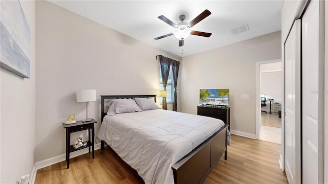 bedroom featuring light wood-type flooring and ceiling fan