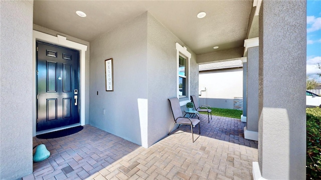 entrance to property featuring a porch