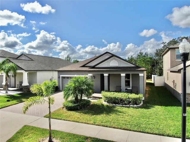 view of front facade with a front yard and a garage