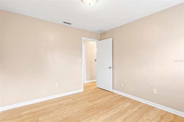 unfurnished room featuring light wood-type flooring