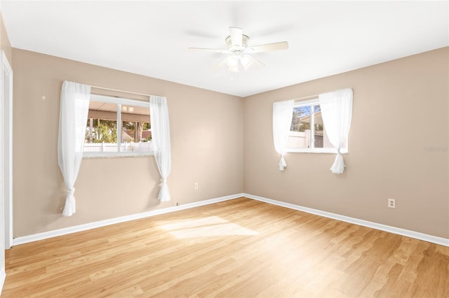 empty room featuring ceiling fan and wood-type flooring