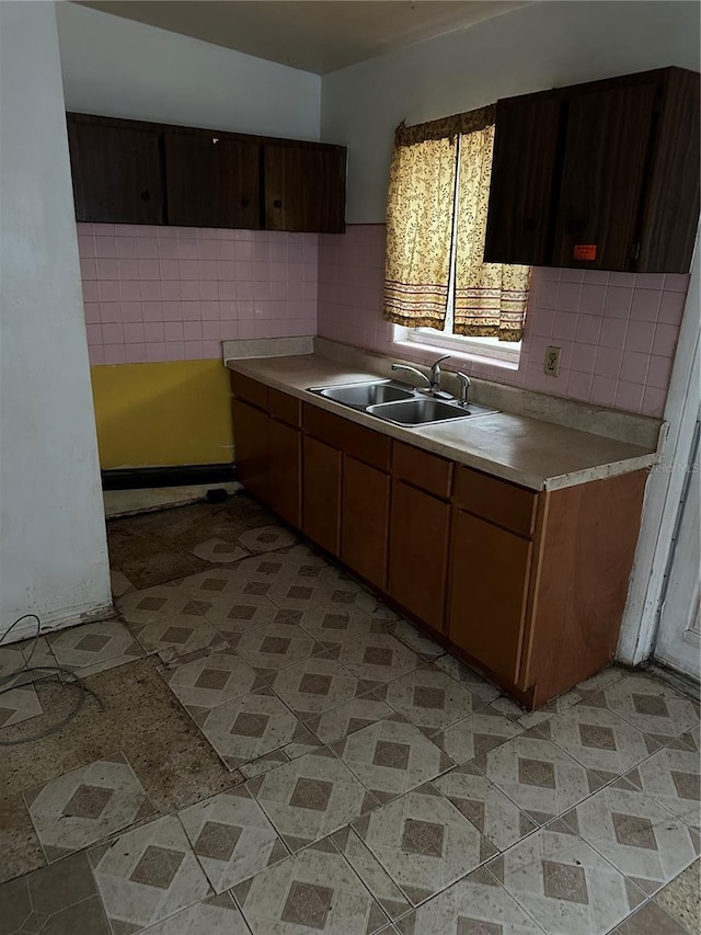 kitchen with decorative backsplash and sink