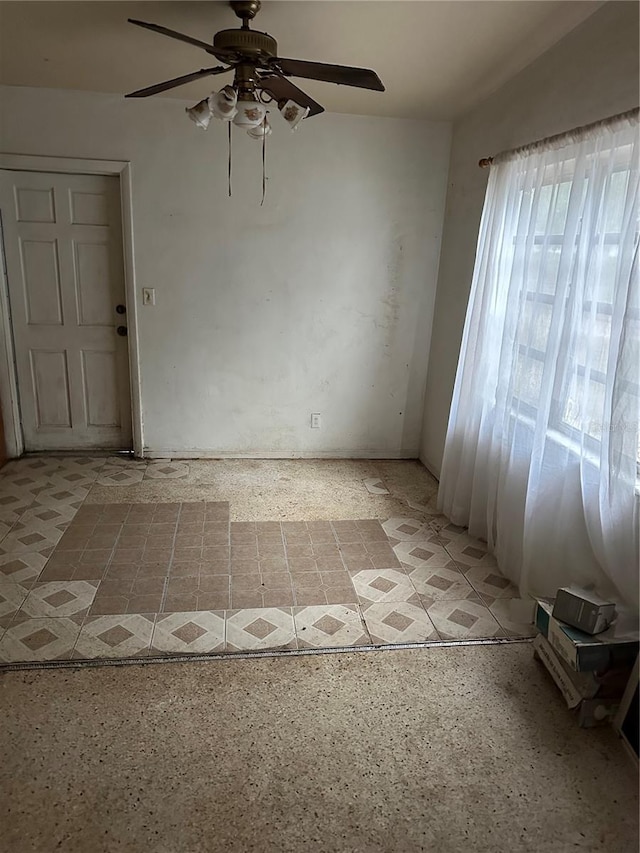 spare room featuring ceiling fan