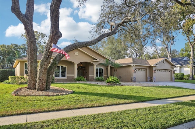 single story home featuring a front yard and a garage