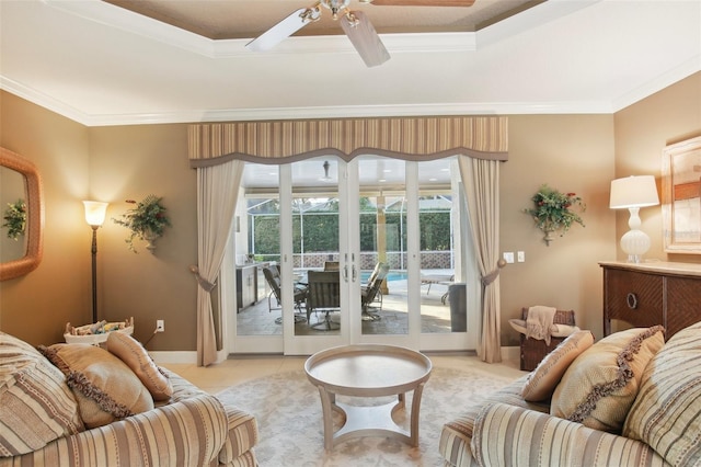 tiled living room with ceiling fan and crown molding