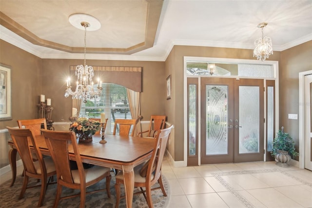 dining room featuring french doors, ornamental molding, a notable chandelier, and light tile patterned flooring