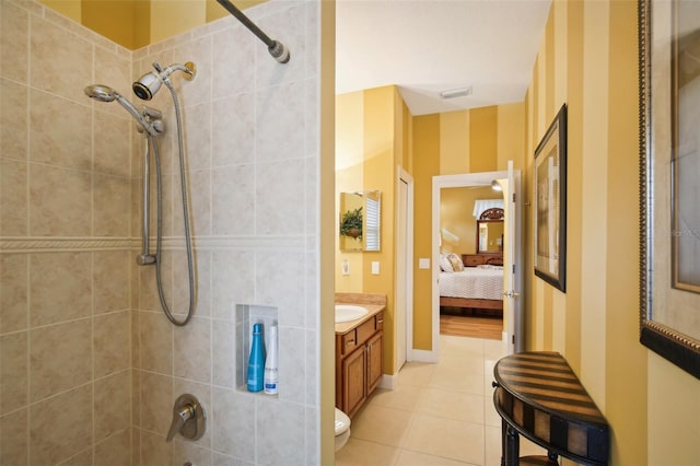 bathroom featuring tile patterned floors, vanity, and toilet