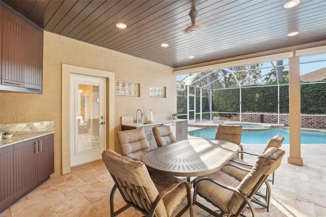 interior space with sink, wooden ceiling, and a pool