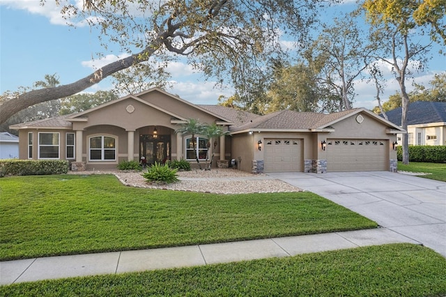 ranch-style house featuring a front lawn and a garage