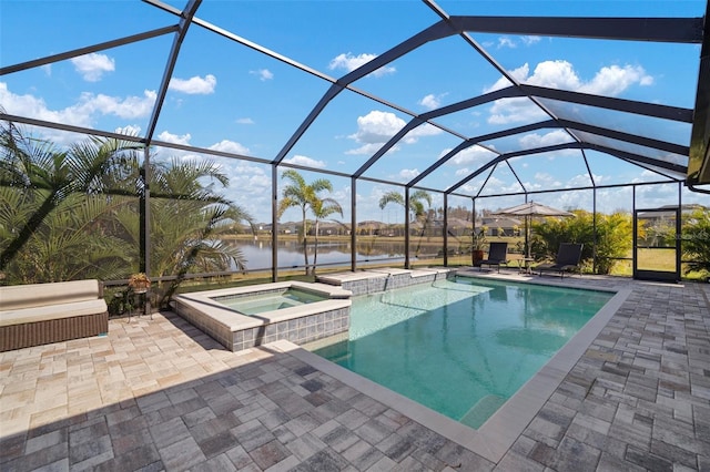 view of swimming pool featuring a water view, glass enclosure, a pool with connected hot tub, and a patio area