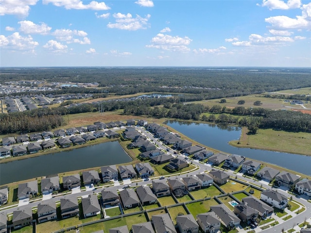 birds eye view of property with a water view and a residential view