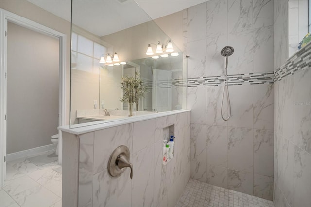 full bathroom with toilet, marble finish floor, walk in shower, and vanity