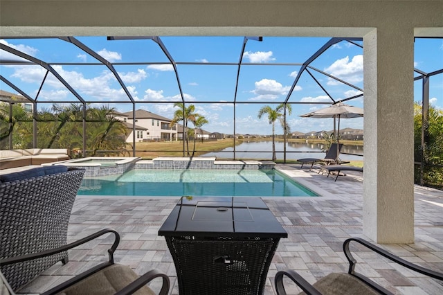 view of swimming pool with a patio, a water view, and a lanai