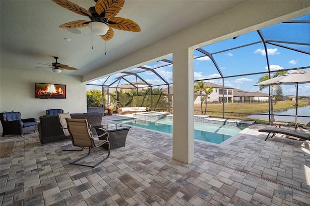 view of patio with ceiling fan, glass enclosure, outdoor lounge area, a water view, and a pool with connected hot tub