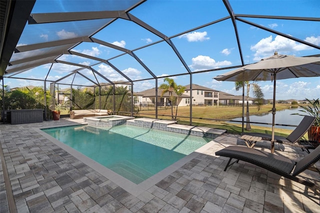 view of pool with a pool with connected hot tub, a lanai, a water view, and a patio