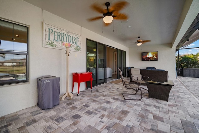 view of patio featuring outdoor lounge area and ceiling fan