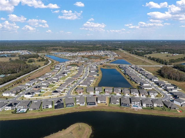 birds eye view of property featuring a water view and a residential view