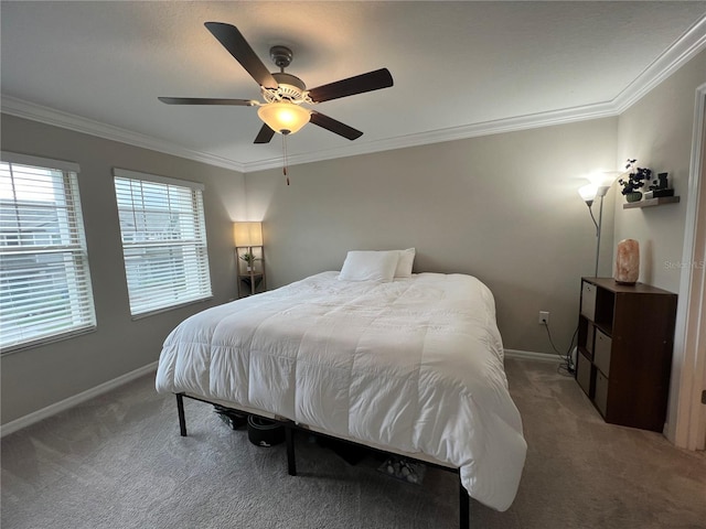 bedroom with carpet, ceiling fan, and crown molding