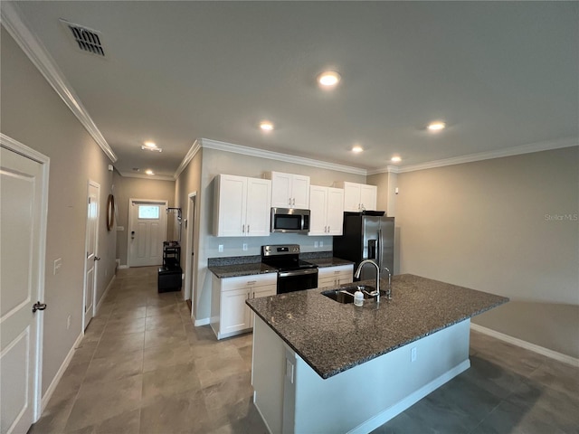 kitchen featuring appliances with stainless steel finishes, white cabinetry, a kitchen island with sink, and sink