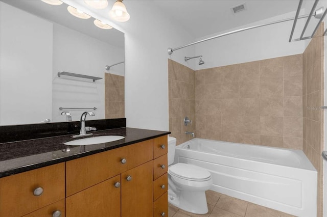full bathroom with tile patterned floors, bathtub / shower combination, toilet, and vanity