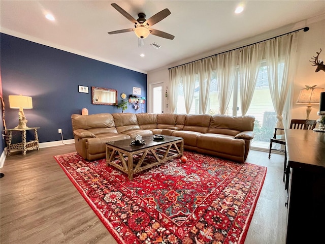 living room with ceiling fan and hardwood / wood-style floors