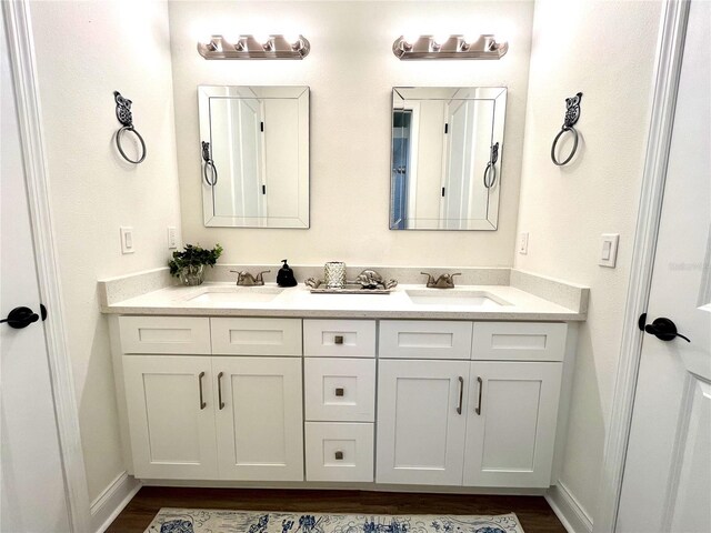 bathroom featuring hardwood / wood-style floors and vanity