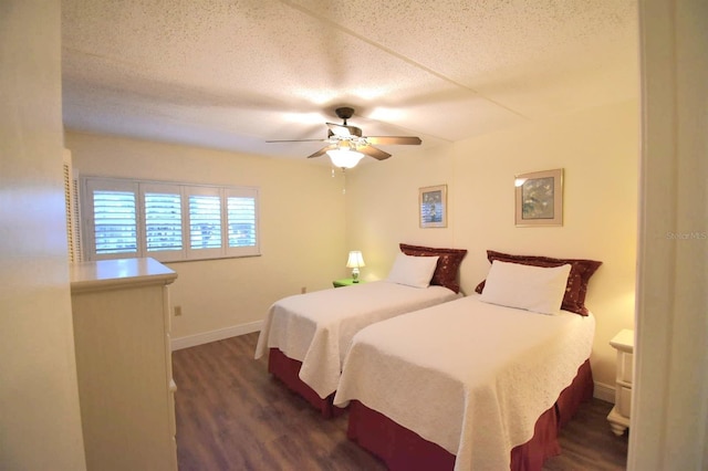 bedroom with ceiling fan and dark wood-type flooring