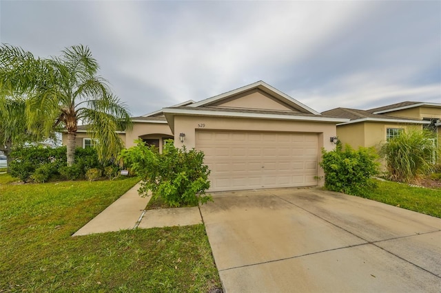 ranch-style home with a garage and a front lawn