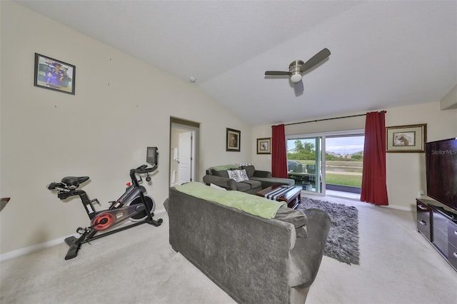 carpeted living room featuring ceiling fan and vaulted ceiling