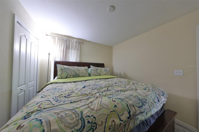 bedroom with carpet floors and a closet