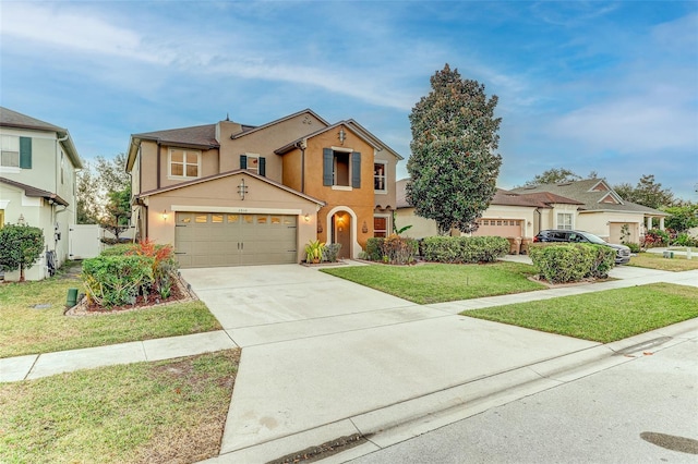 view of front facade with a front yard and a garage