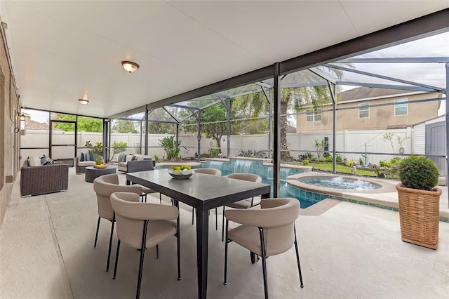 sunroom / solarium featuring a swimming pool with hot tub and a healthy amount of sunlight