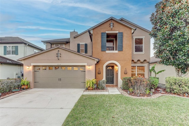 view of front property with a garage and a front yard