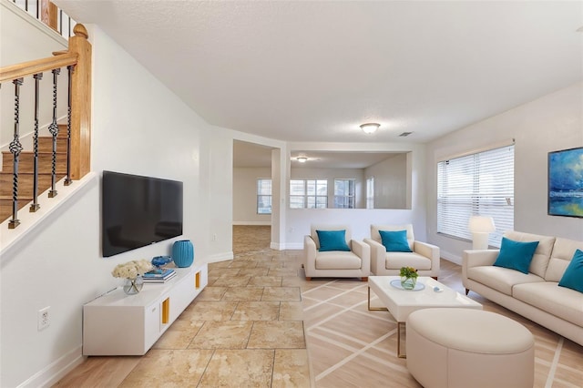 living room with a textured ceiling