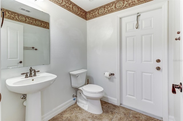 bathroom featuring sink and toilet