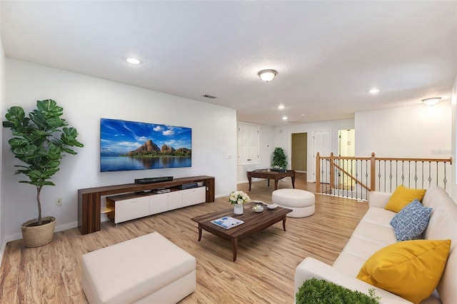 living room with light hardwood / wood-style flooring