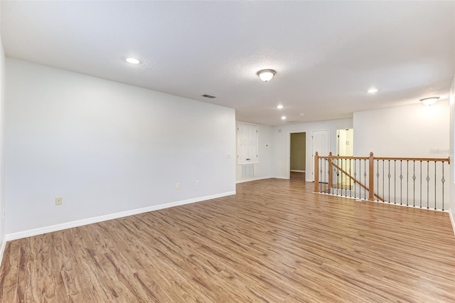 spare room with light wood-type flooring