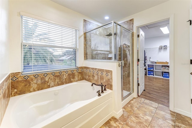 bathroom with shower with separate bathtub