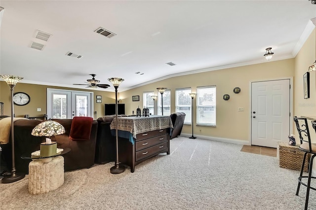 living room featuring french doors, light colored carpet, and a healthy amount of sunlight