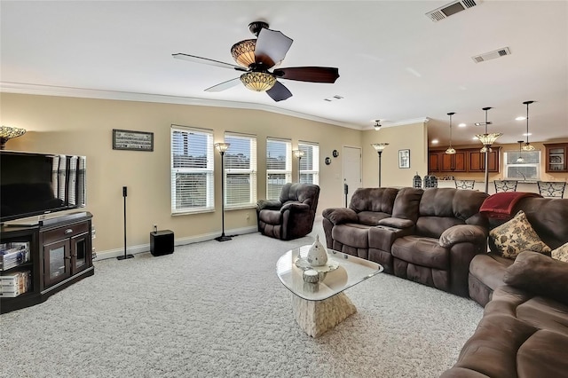 living room featuring ceiling fan, light colored carpet, and ornamental molding