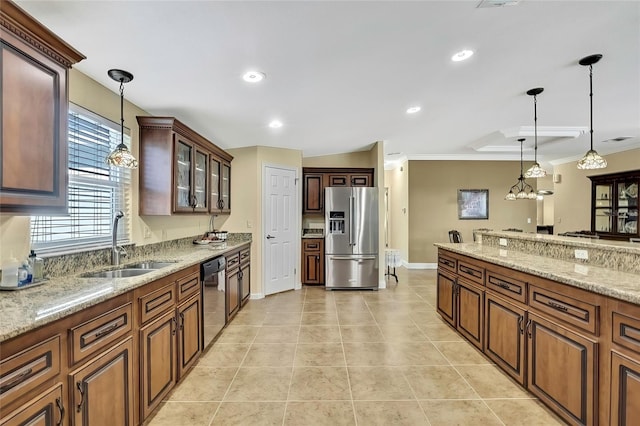 kitchen with light stone countertops, sink, stainless steel appliances, decorative light fixtures, and ornamental molding