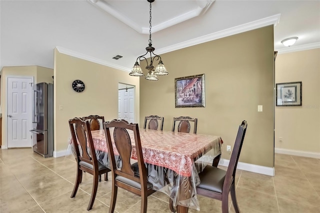 dining room with crown molding, light tile patterned floors, and an inviting chandelier