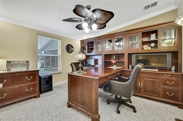 office area featuring light colored carpet, vaulted ceiling, ceiling fan, and ornamental molding