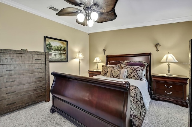 bedroom featuring ceiling fan, crown molding, and light colored carpet