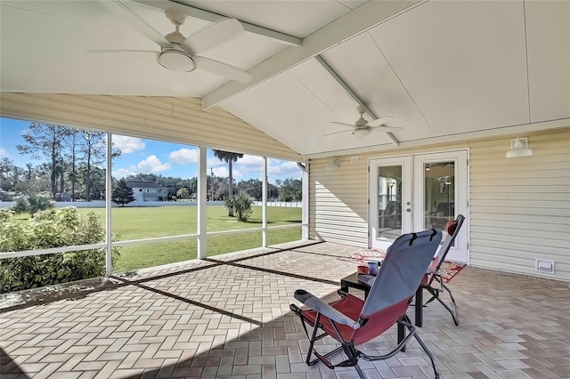 sunroom / solarium with french doors, ceiling fan, and lofted ceiling