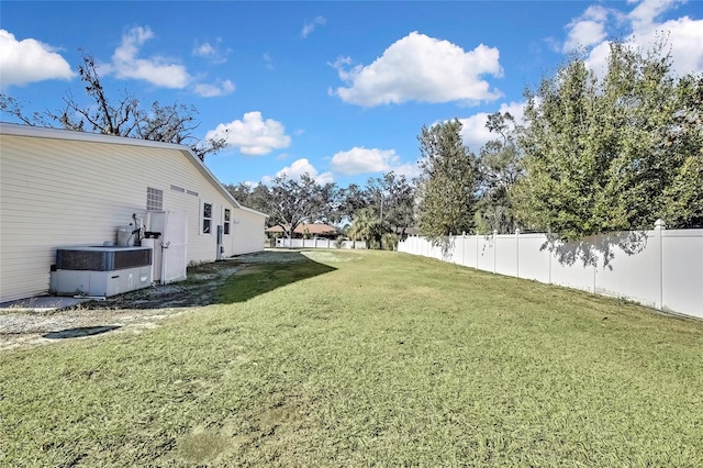 view of yard featuring central AC